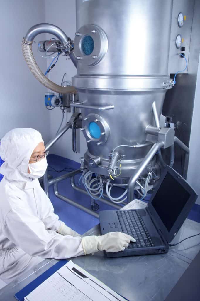 A bioscience technician processing product upstream.