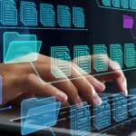 hands typing on keyboard with images of documents and files superimposed